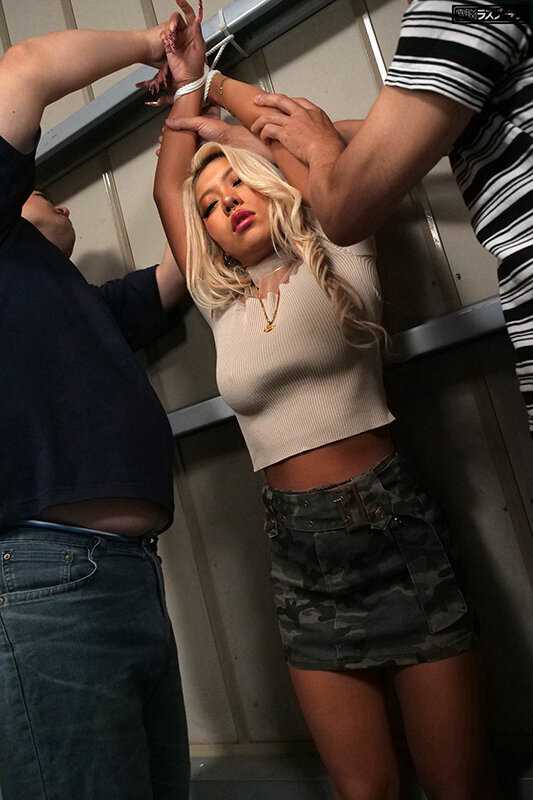 A sensitive woman named Sena Rumina experiences intense stimulation on a crowded train while wearing a revealing outfit, leading to uncontrollable expressions